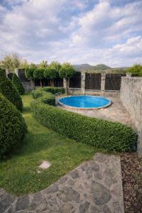 a swimming pool in the middle of a yard at Cottage Smerekovyi in Skole