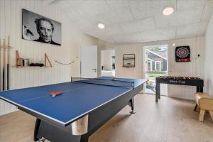 a ping pong table in a room with a ping pong ball at BV208-Blavand-Strandparken-16 in Blåvand