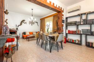 a living room with a table and chairs and a couch at Aquarius View in Archipolis