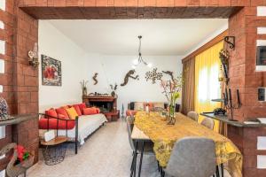a living room with a table and a couch at Aquarius View in Archipolis