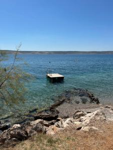 a dock in the middle of a large body of water at Nadalina 9 in Starigrad +7 photos