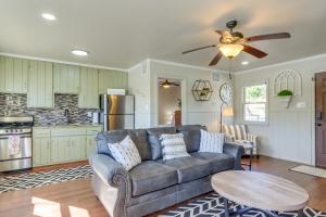 a living room with a couch and a ceiling fan at Lakefront Eucha Escape w/ Views & Boat Slip! in Eucha