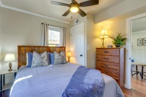 a bedroom with a bed and a ceiling fan at Lakefront Eucha Escape w/ Views & Boat Slip! in Eucha