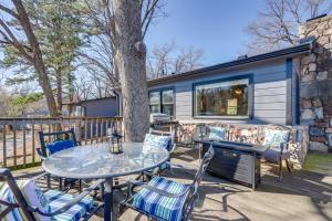 a patio with a table and chairs and a caravan at Lakefront Eucha Escape w/ Views & Boat Slip! in Eucha