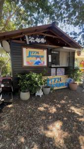 a food truck with potted plants in front of it at 1770 Holiday Village in Seventeen Seventy