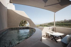 a swimming pool in the middle of a house at Galaria Serenity Suites in Vóthon