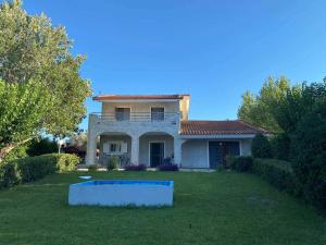 a house with a swimming pool in the yard at Villa Erato Keratea in Keratea