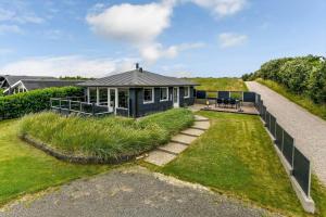 a small house with a pathway leading to it at BV138-Esbjerg-V-Sjelborgdalen-108 in Esbjerg