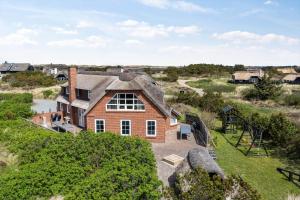 an aerial view of a house with a roof at BV277-Blavand-Klitvej-4 in Blåvand