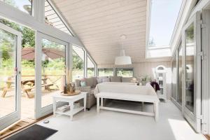a living room with a couch and a table at BV366-Blavand-Skaubjergvej-4 in Blåvand
