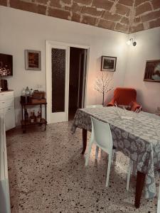 a dining room with a table and chairs in a room at Giovanna Home in Marsala