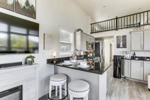 a kitchen with a counter and two stools at Great Outdoor Space! Serene Getaway in Oakland in Oakland