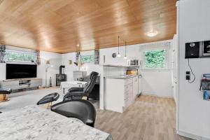 a room with a kitchen and a living room at 198-Ringkobing-Bogealle-8 in Nørby +17 photos