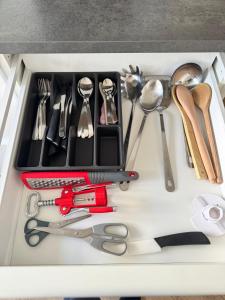 a drawer filled with lots of kitchen utensils at La Casa di Vale in Ventimiglia