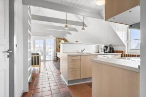 a kitchen with a sink and a counter at 290-Ringkobing-Nordso-Ferievej-50 in Nørre Lyngvig +27 photos
