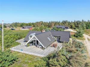 an overhead view of a house with a deck at 221-Ringkobing-Havklitvej-72 in Klegod +23 photos