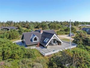 an aerial view of a house with a deck at 221-Ringkobing-Havklitvej-72 in Klegod