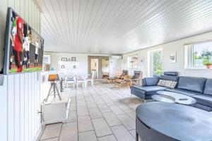 a living room with a couch and a table at 286-Ringkobing-Vestklitvej-14 in Klegod