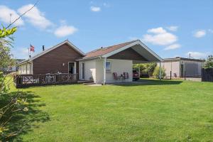 a house with a large yard with a house at 138-Ringkobing-Sondervig-Klitvej-3 in Søndervig