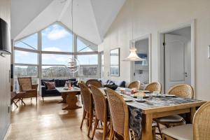 a dining room with a table and chairs at 1177-Ringkobing-Anders-Juhls-Vej-10 in Søndervig