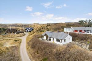 a house on a hill with a winding road at 1177-Ringkobing-Anders-Juhls-Vej-10 in Søndervig