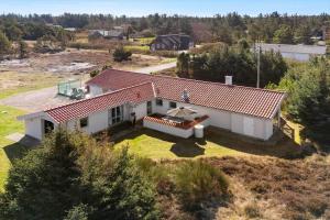 an aerial view of a white house with a red roof at 2202-Ringkobing-Lyngvejen-73 in Klegod