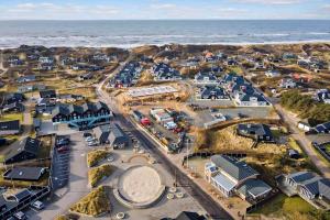 an aerial view of a town next to the ocean at 1194-Ringkobing-Havstien-203 in Søndervig