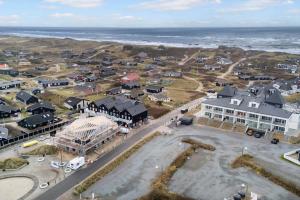 an aerial view of a town next to the ocean at 1088-Ringkobing-Badevej-17-C-1-TV in Søndervig