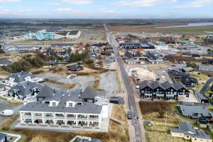 an aerial view of a small town with houses at 1087-Hvide-Sande-Badevej-17-C-1-MF in Søndervig