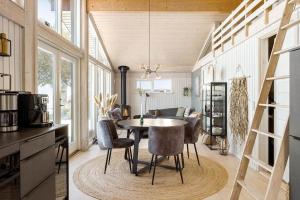 a kitchen with a table and chairs in a room at FY325-Munkebo-Kamsbjerghuse-1-b in Munkebo +18 photos