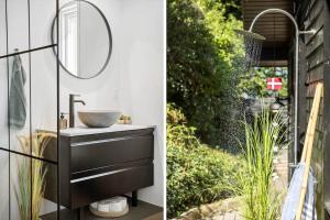 a bathroom with a sink and a mirror at FY325-Munkebo-Kamsbjerghuse-1-b in Munkebo