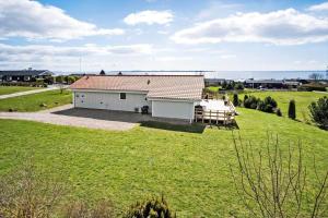 a house in a field with a large yard at FY289-Faaborg-Avernakovej-22 in Faaborg