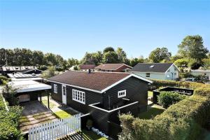 an aerial view of a house with a white fence at FY318-Nyborg-Sommerbyen-23 in Nyborg