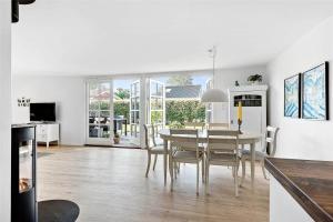 a kitchen and dining room with a table and chairs at FY318-Nyborg-Sommerbyen-23 in Nyborg