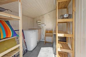 a small room with bunk beds and a kitchen at FY261-Ebberup-Hasselvaenget-22 in Ebberup +14 photos