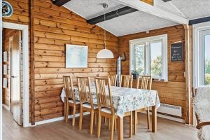 a dining room with a table and chairs at FY349-Svendborg-Blaklokkevej-8 in Svendborg