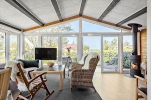 a living room with a couch and a table at FY349-Svendborg-Blaklokkevej-8 in Svendborg