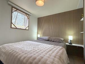 a bedroom with a large bed and a window at t Heische hofje in Zeeland +26 photos