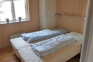 two beds in a room with two pillows at FY292-Faaborg-Mosegarden-40 in Faaborg