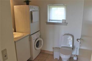 a small bathroom with a toilet and a sink at FY292-Faaborg-Mosegarden-40 in Faaborg