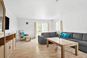 a living room with a couch and a table at FY283-Broby-Sandholtvej-45 in Brolo