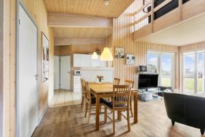 a kitchen and dining room with a table and chairs at FY295-Faaborg-Mosegarden-39 in Faaborg