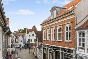 a street in a town with buildings at FY399-Bogense-Ostergade-5-a in Bogense