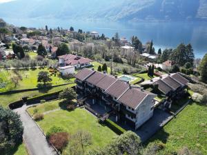 an aerial view of a house with a yard at Prati Escape - Apartment with Pool and Lakeview in Lierna