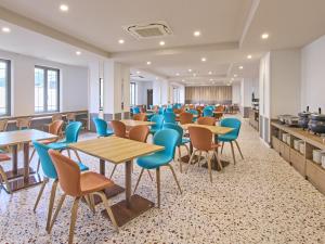 a waiting room with tables and chairs at Centara Life Namba Hotel Osaka in Osaka