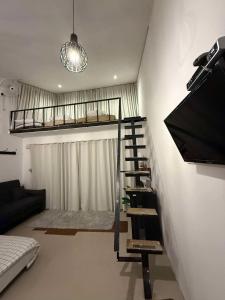 a living room with a bunk bed and a tv at Erawan Mountain Beach & Maya Erawan & Goodview Erawan in Tha Kradan