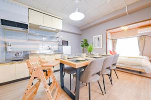 a kitchen and dining room with a table and chairs at 弥富民泊 - Yatomi Minpaku - in Yatomi 