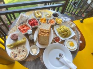 a table topped with plates of food on a table at Restora Ella in Ella