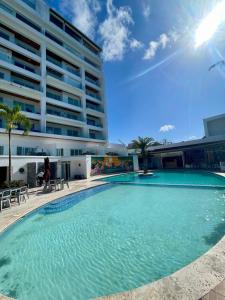a large swimming pool in front of a building at Laguna Azul Boca Beach in Boca Chica