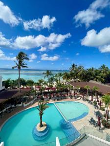 a view of the pool at the excellenceidental coconut groynes resort at Laguna Azul Boca Beach in Boca Chica